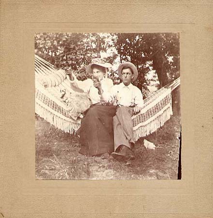 Photo Detail - Anonymous - Woman and Man on Hammock with Pistols