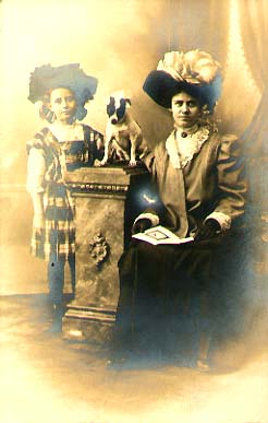 Photo Detail - Anonymous - Woman and Girl with Fancy Hats and a Dog on a Column