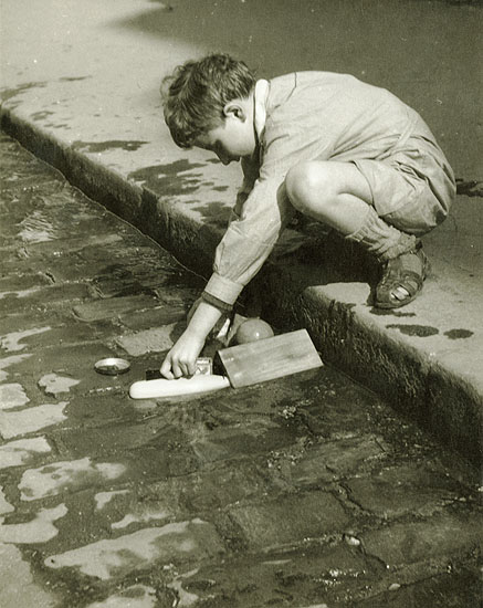 Photo Detail - Pierre Auradon - Boy Playing by a Street Curb, Paris