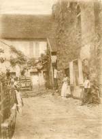 Women in Conversation in Farm Yard