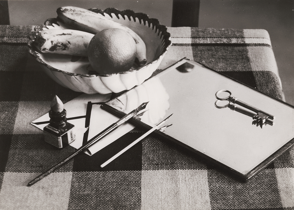 André Kertész - Table with Fruit Bowl, Ink, Pen, Mirror, and Key