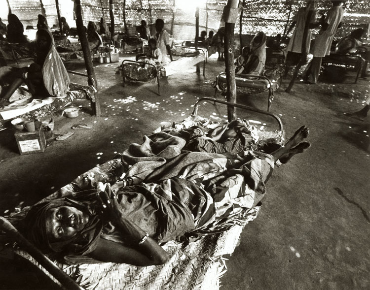 Photo Detail - Barry Thumma - Woman Lies near Death from Famine in Ethiopia