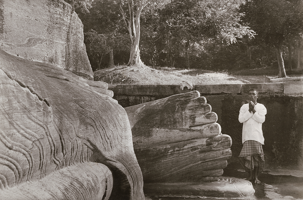 Henri Cartier-Bresson - Man Praying at the Foot of Buddha, Sri Lanka
