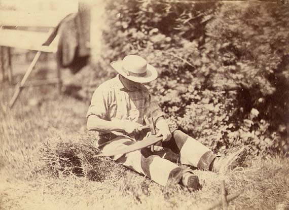 Photo Detail - Anonymous - Man Repairing Sickle with a Hammer