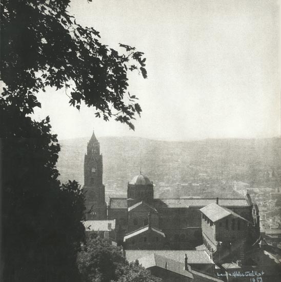 Laure Albin-Guillot - Scene of a Church and the Town Beyond, France