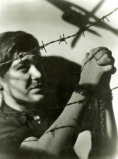 Photo Detail - Bohumil Stastny - Boy Praying in Chains Against Barbed Wire