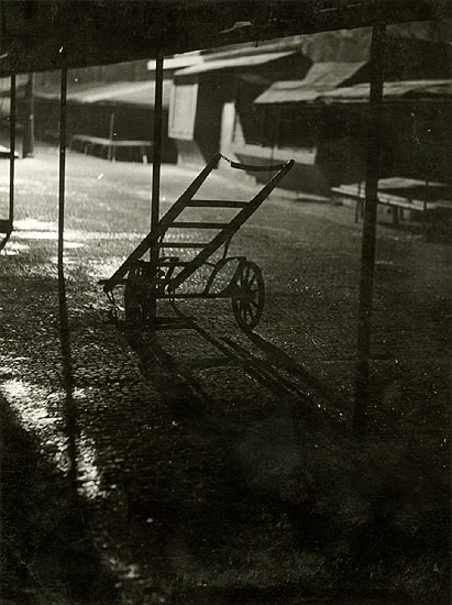Bohumil Stastny - Two-Wheel Cart in Front of Market Stores at Night
